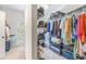 Walk-in closet with shelves, racks, and storage for clothes and luggage at 1219 Hadaway Ct, Lawrenceville, GA 30043