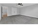 Bedroom with carpet, ceiling fan, large closet and attached bath at 153 Alaina Rd, Holly Springs, GA 30115