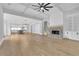 Expansive living room showcasing hardwood floors, coffered ceilings, and an open-concept layout at 153 Alaina Rd, Holly Springs, GA 30115