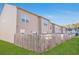 Spacious backyard with lush green grass and a wooden fence bordering the property at 1958 Dillon Dr, Lithonia, GA 30058