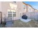 Cozy backyard with a grill, a small concrete patio, and a partial view of the home's exterior at 1958 Dillon Dr, Lithonia, GA 30058