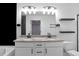 Bathroom featuring a double vanity, large mirror, and toilet at 1958 Dillon Dr, Lithonia, GA 30058