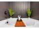 Modern bathtub with spa-like decor and minimalist design at 1958 Dillon Dr, Lithonia, GA 30058