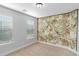 Whimsical bedroom features a colorful jungle-themed accent wall, great natural light at 1958 Dillon Dr, Lithonia, GA 30058