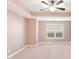 Bedroom with tray ceiling, neutral carpet, and window with blinds at 1958 Dillon Dr, Lithonia, GA 30058