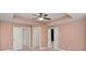 Cozy bedroom with tray ceiling, ceiling fan, and neutral paint provides a relaxing atmosphere at 1958 Dillon Dr, Lithonia, GA 30058