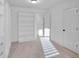 Bright walk-in closet has custom shelving and ample storage space at 1958 Dillon Dr, Lithonia, GA 30058
