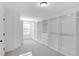 Large walk-in closet offers ample storage with custom built-in shelving and drawers at 1958 Dillon Dr, Lithonia, GA 30058