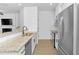 Contemporary kitchen featuring granite counters, stainless appliances, and bar seating at 1958 Dillon Dr, Lithonia, GA 30058
