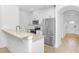 Modern kitchen with stainless steel appliances, granite countertops, and white cabinets at 1958 Dillon Dr, Lithonia, GA 30058