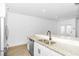 Bright kitchen showcasing granite countertops, stainless steel dishwasher, and modern faucet at 1958 Dillon Dr, Lithonia, GA 30058