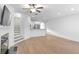 Spacious living room with modern fireplace and view of the kitchen and staircase at 1958 Dillon Dr, Lithonia, GA 30058