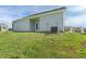 View of the back of the home from the grassy backyard at 196 Al Jennah Blvd, Locust Grove, GA 30248