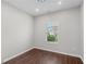 Simple bedroom with natural light highlighting wood-look floors at 196 Al Jennah Blvd, Locust Grove, GA 30248