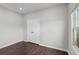 Bedroom featuring a double door closet and a window with a view of the outside at 196 Al Jennah Blvd, Locust Grove, GA 30248
