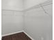 Walk-in closet with rod and shelf storage system at 196 Al Jennah Blvd, Locust Grove, GA 30248