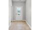 Welcoming entryway featuring ceramic tile flooring, a decorative door, and light gray walls at 196 Al Jennah Blvd, Locust Grove, GA 30248