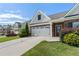 Stunning brick home exterior with a manicured lawn, featuring an attached two-car garage and walkway at 196 Al Jennah Blvd, Locust Grove, GA 30248