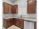 Eat-in kitchen features granite countertops, stainless steel dishwasher and custom wood cabinetry at 196 Al Jennah Blvd, Locust Grove, GA 30248