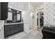 Bathroom featuring a tiled shower, patterned wallpaper, and vanity at 207 E Hightower E Trl, Social Circle, GA 30025