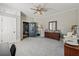 Bedroom with neutral paint, a ceiling fan, and carpet at 207 E Hightower E Trl, Social Circle, GA 30025