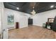 Bonus room with light-colored floors, a Murphy bed, and a dark ceiling at 207 E Hightower E Trl, Social Circle, GA 30025