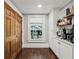 Coffee bar area features custom cabinets and shelving at 207 E Hightower E Trl, Social Circle, GA 30025