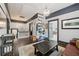 Upstairs hallway featuring hardwood floors, a built-in bookshelf, and neutral paint at 207 E Hightower E Trl, Social Circle, GA 30025