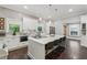 Bright kitchen with gray brick accents, white cabinetry, quartz countertops, and stainless appliances at 207 E Hightower E Trl, Social Circle, GA 30025