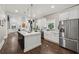Expansive kitchen includes a large island, stainless steel appliances, and lots of cabinet space at 207 E Hightower E Trl, Social Circle, GA 30025