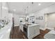 Cozy kitchen boasts a stove-top island, stainless steel appliances, and lots of natural light at 207 E Hightower E Trl, Social Circle, GA 30025