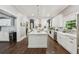 Bright, open kitchen with a large island, stainless appliances, and plenty of cabinets at 207 E Hightower E Trl, Social Circle, GA 30025