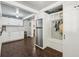 Mud room area with built in storage lockers and bench, attached to pantry area with stainless refrigerator at 207 E Hightower E Trl, Social Circle, GA 30025