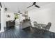 Charming outdoor kitchen area, complete with a built-in grill, bar seating, and a covered dining area at 207 E Hightower E Trl, Social Circle, GA 30025