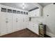 Pantry area featuring custom cabinets, countertop and storage, plus a wine cooler at 207 E Hightower E Trl, Social Circle, GA 30025