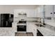 Kitchen with white cabinets, stainless steel appliances, and granite countertops at 2864 Parkway Close, Lithonia, GA 30058