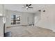 Bright living room with neutral carpet, staircase and a view into a bright kitchen at 2864 Parkway Close, Lithonia, GA 30058