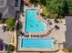 Aerial view of the community pool, complete with lounging areas and a lap pool for residents enjoyment at 3502 Village Green Dr, Roswell, GA 30075
