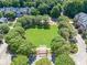 Beautiful community park featuring a pergola surrounded by lush trees and manicured lawn at 3502 Village Green Dr, Roswell, GA 30075