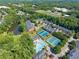 Community amenities include tennis courts, a swimming pool, and a pond surrounded by lush greenery at 3502 Village Green Dr, Roswell, GA 30075