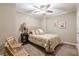 Cozy bedroom with a ceiling fan, neutral color palette and inviting natural light at 3502 Village Green Dr, Roswell, GA 30075