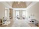 Spacious bedroom featuring a vaulted ceiling, natural light, and cozy decor at 3502 Village Green Dr, Roswell, GA 30075