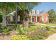Beautifully landscaped clubhouse with brick exterior and manicured lawn, enhancing the community appeal at 3502 Village Green Dr, Roswell, GA 30075
