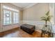 Elegant entryway featuring hardwood floors, wainscoting, transom windows, and stylish decor accents at 3502 Village Green Dr, Roswell, GA 30075