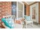 Inviting front porch with two chairs and pillows at 3502 Village Green Dr, Roswell, GA 30075
