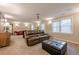 Inviting finished game room with large sectional sofa, ottoman, and comfortable seating at 3502 Village Green Dr, Roswell, GA 30075