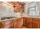 Gourmet kitchen with custom wood cabinets, granite countertops, tile backsplash, and stainless steel appliances at 3502 Village Green Dr, Roswell, GA 30075