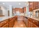 Well-appointed kitchen with stainless steel appliances and granite countertops at 3502 Village Green Dr, Roswell, GA 30075