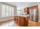 Bright kitchen with hardwood floors, stainless steel appliances, and a center island at 3502 Village Green Dr, Roswell, GA 30075