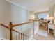 Bright and airy landing area featuring wood floors, and a glimpse of a home office at 3502 Village Green Dr, Roswell, GA 30075